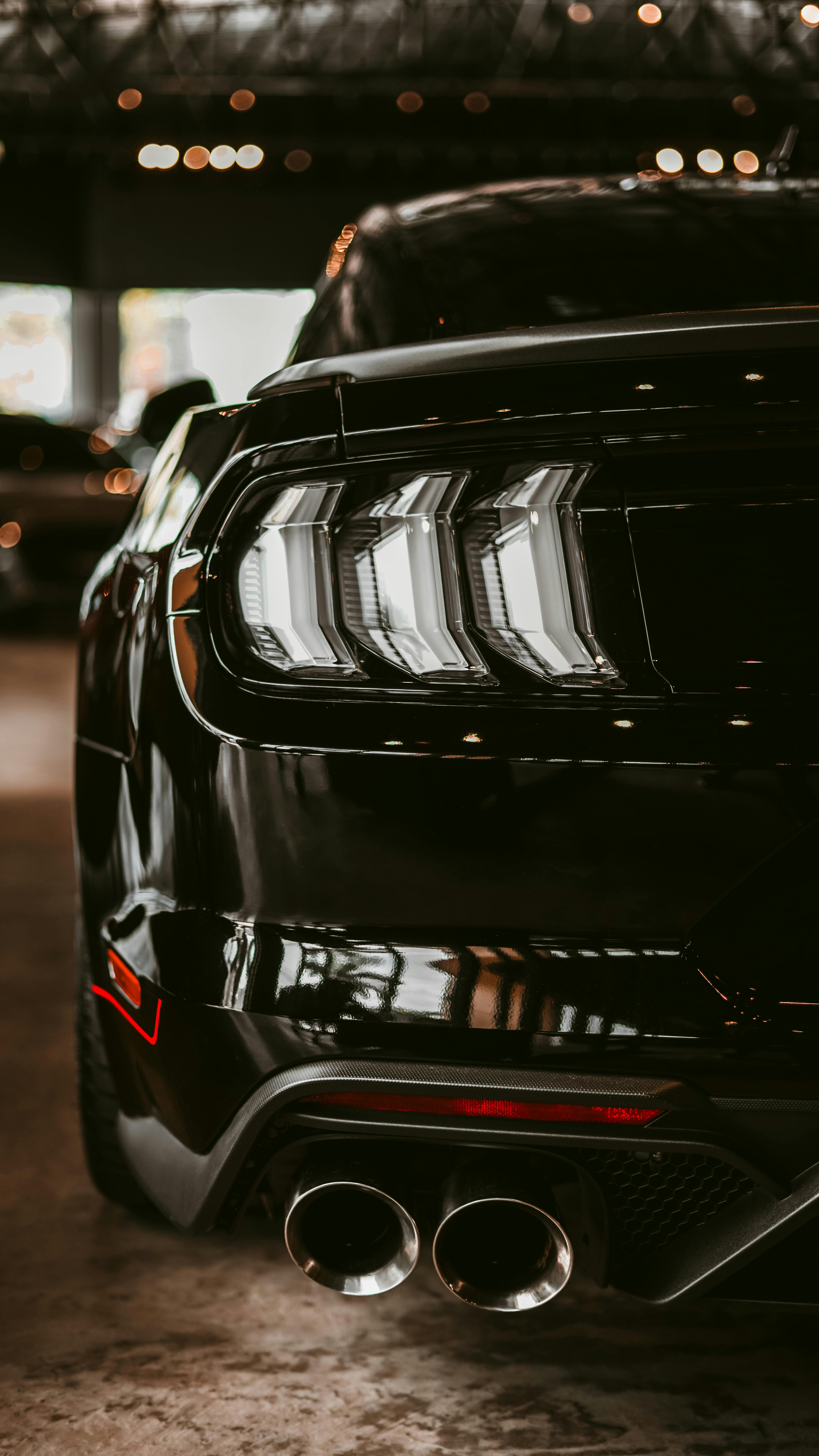 Glossy black performance car after paint refinement